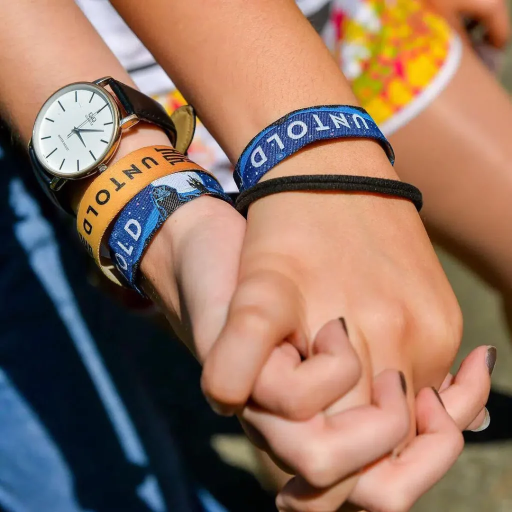 two-people-wearing-untold-wristbands