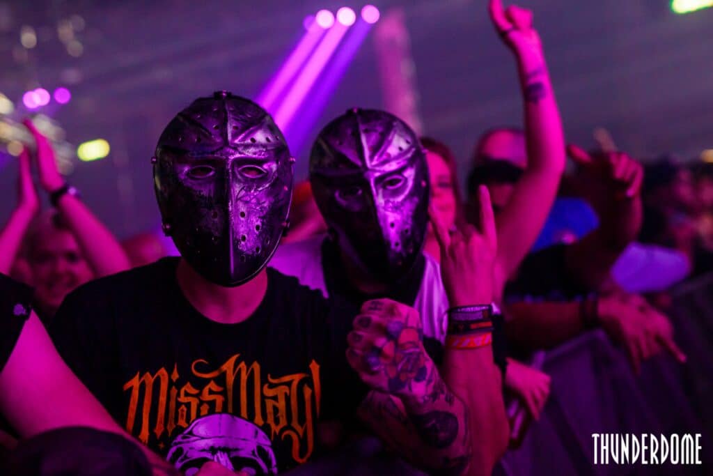 two-festival-goers-wearing-masks-at-thunderdome