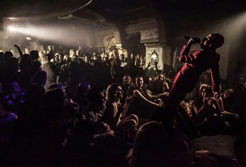 artist-performing-on-stage-in-front-of-crowds-at-the-box-soho