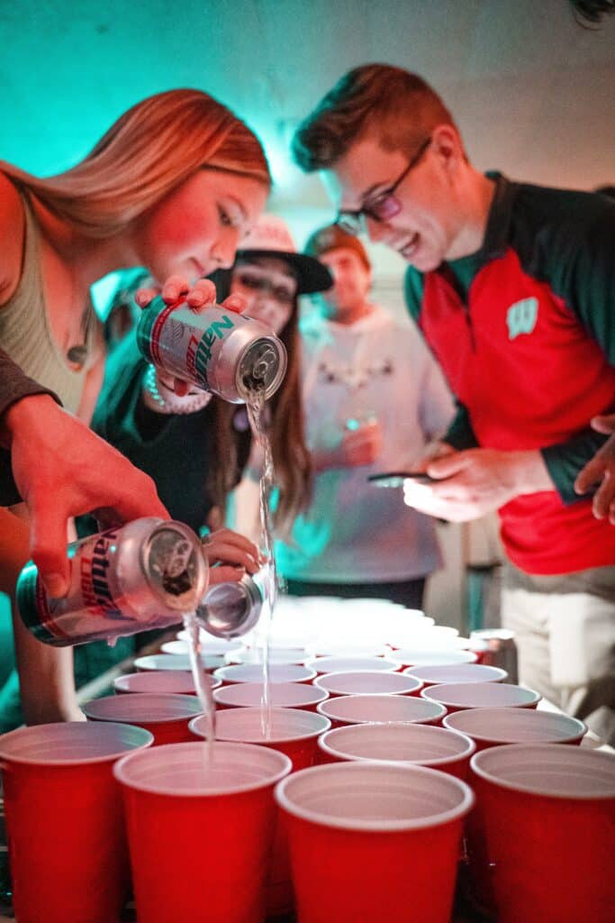 people-preparing-alcohol-at-a-house-party