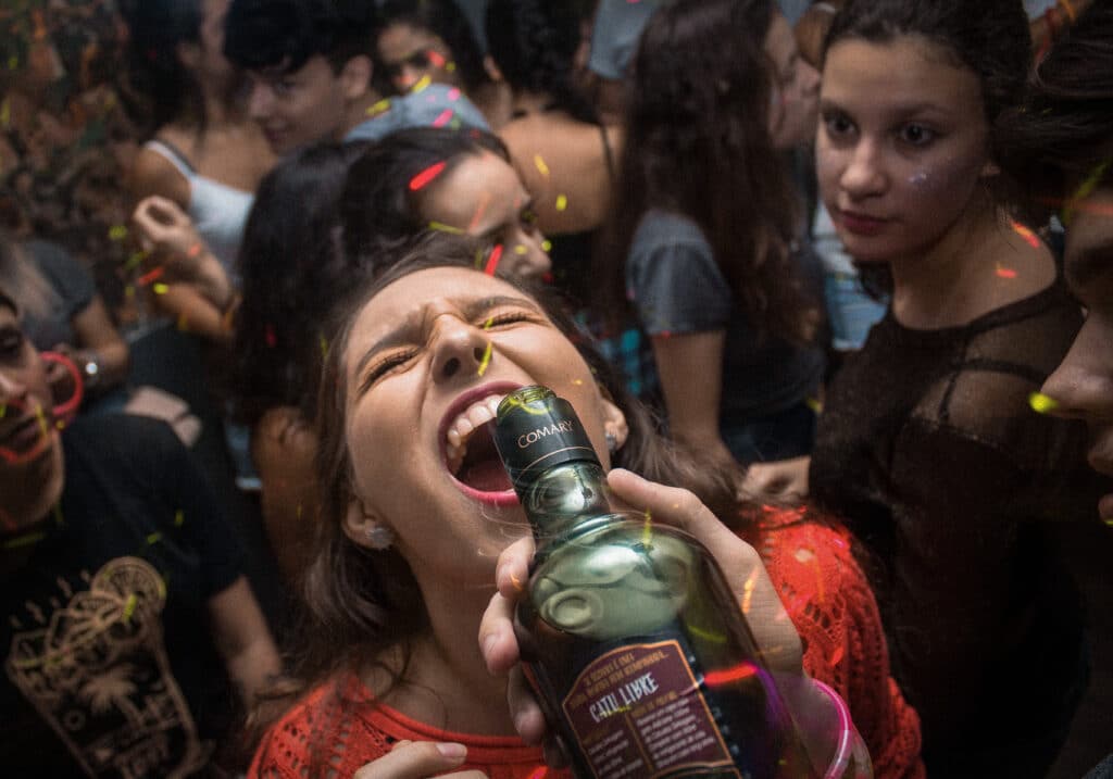 girl-downing-a-bottle-of-wine