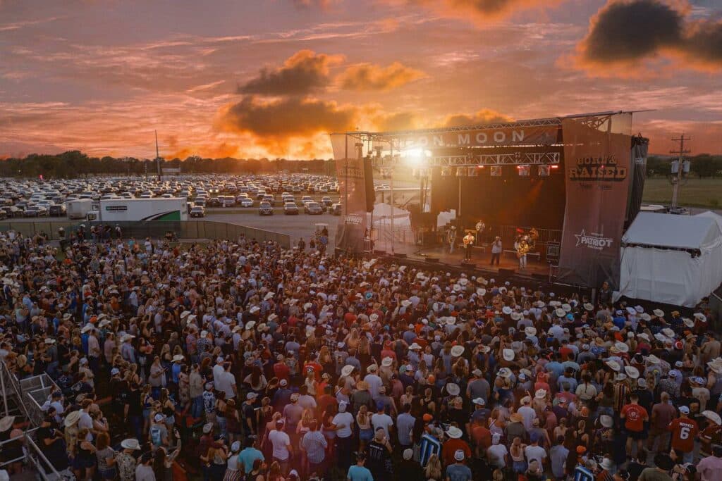 view-from-above-of-crowd-and-stage-at-born-&-raised-festival